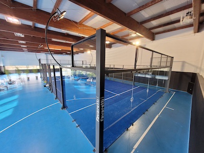Padel facility with multiple courts and covered structures